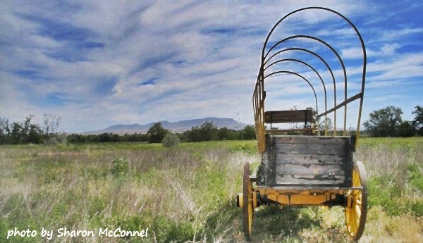 covered wagon frame pointed toward Butte